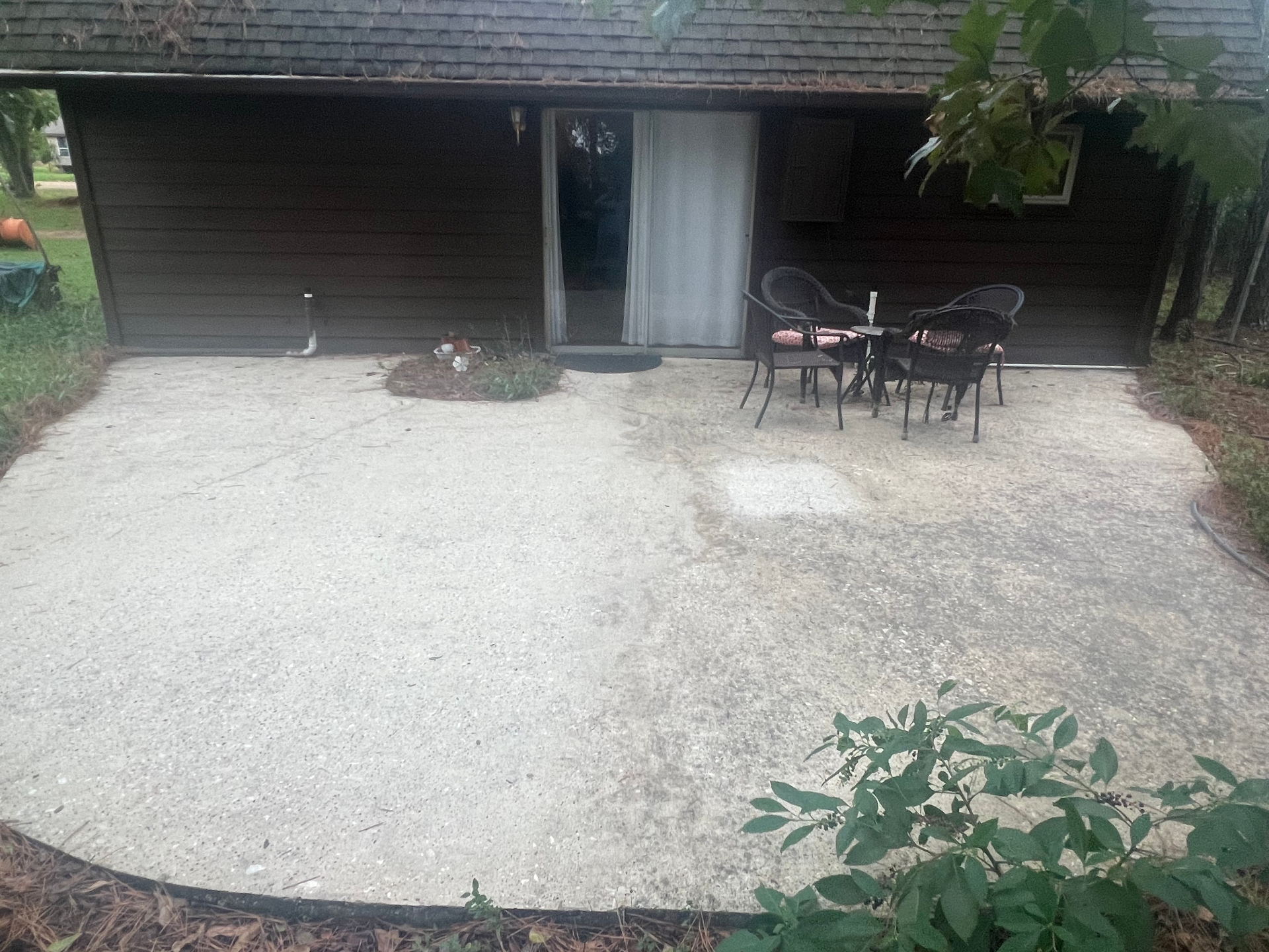 Patio after three months outdoor exposure, sealed half still clean, unsealed half beginning to discolor