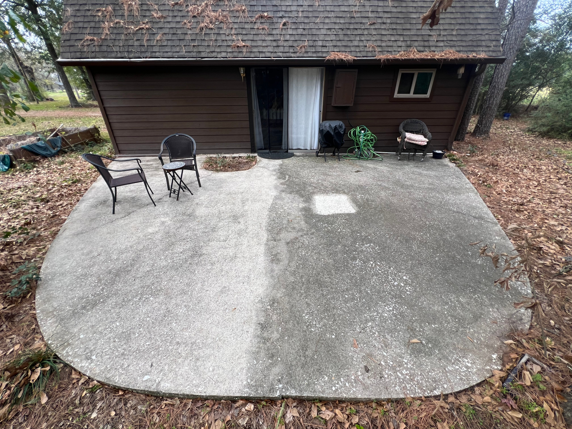 Patio in winter at twenty-nine months, sealed half still cleaner than unsealed control